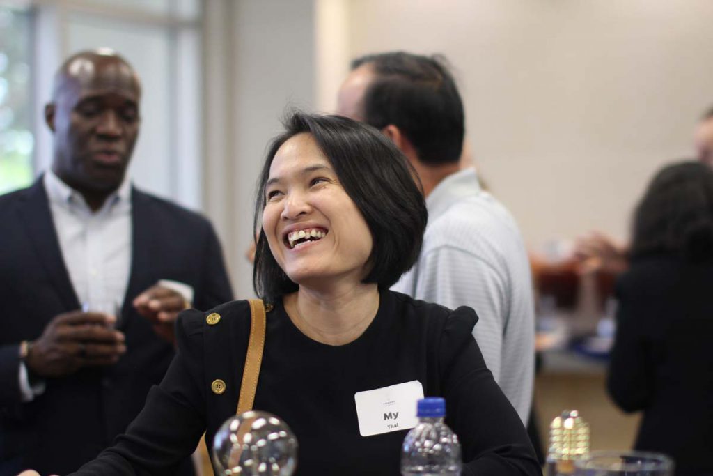 Dr. Thai holds a trophy she received for her "invention of the year" at an event to honor inventors called Standing Innovation