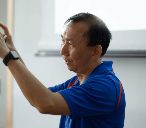 UF staff explaining something with hand gestures.